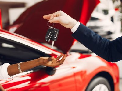 stylish-black-woman-car-salon_1157-21402